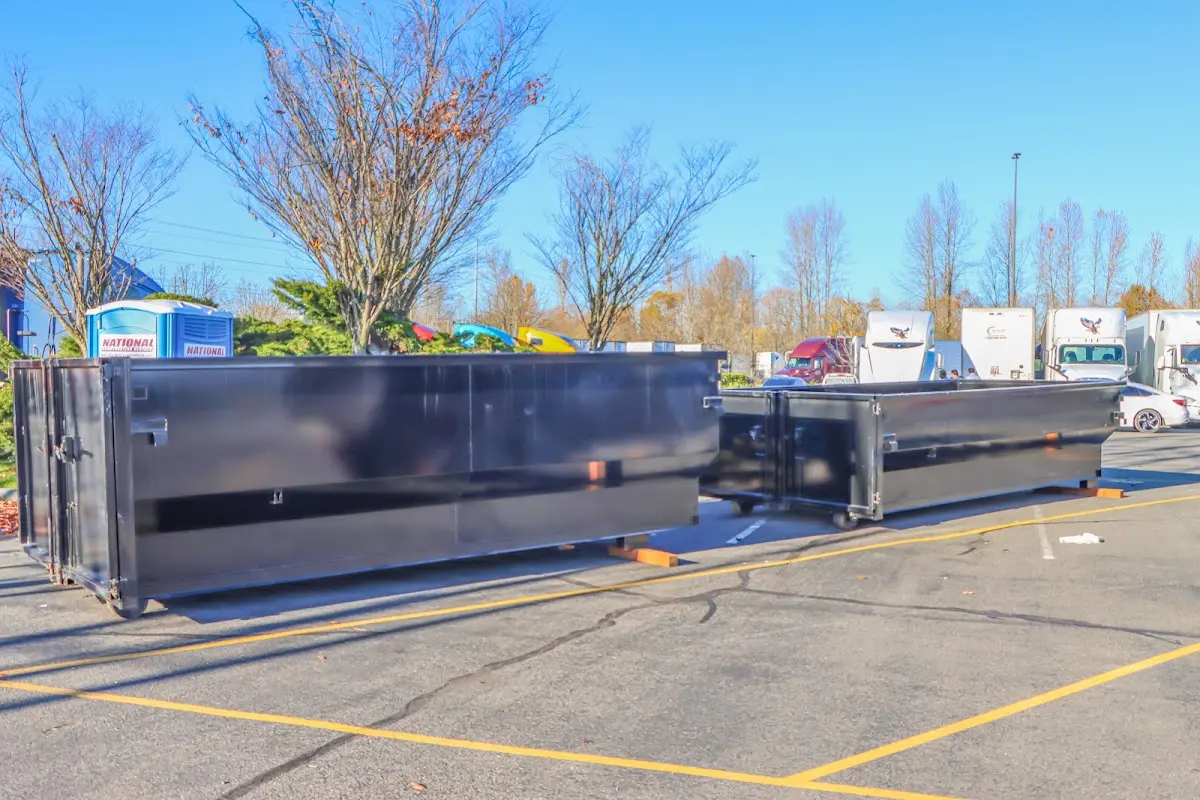 Professional dumpster rental service with roll-off container on residential driveway in Towamencin